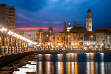 Panoramic view of Bari, Southern Italy, the region of Puglia(Apulia) seafront at dusk. Basilica San...