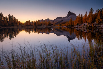 Autumn in the Italian Dolomites. The most beautiful time of the year to visit this place. Beautiful colors and breathtaking views. Mountain peaks above the valleys.