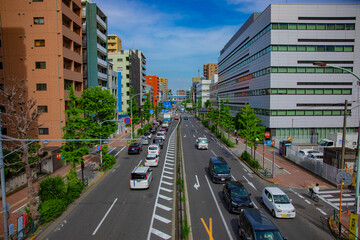 A downtown street at Kanpachi avenue in Tokyo wide shot