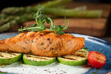 Grilled salmon steak with zucchini and creamy sauce