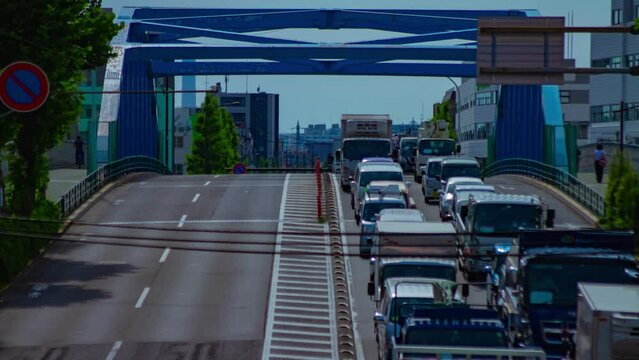 A timelapse of downtown street at Kanpachi avenue in Tokyo long shot tilt