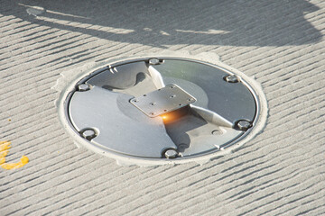 Axial light in the concrete pavement of the runway and steering tracks, coated taxiway.