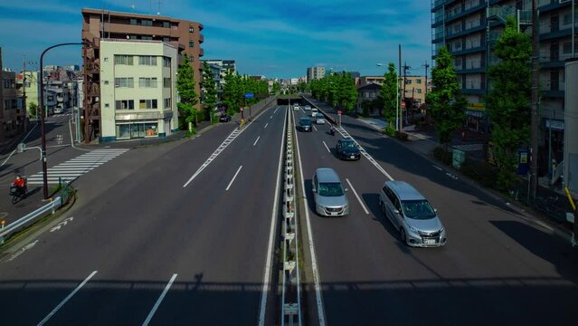 A timelapse of downtown street at Kanpachi avenue in Tokyo wide shot panning