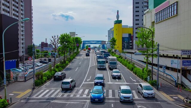 A timelapse of downtown street at Kanpachi avenue in Tokyo wide shot panning