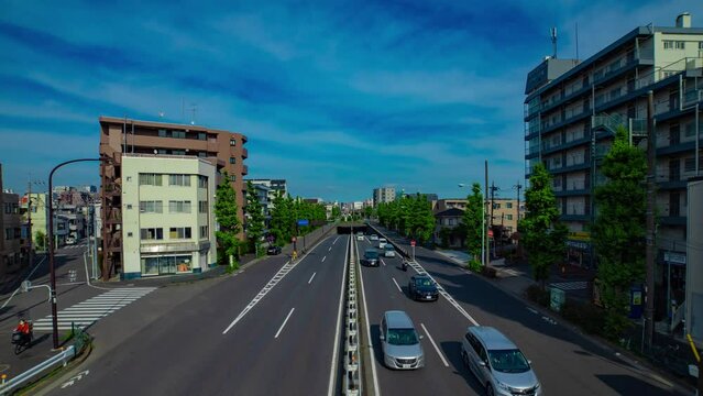 A timelapse of downtown street at Kanpachi avenue in Tokyo wide shot panning
