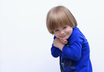 Cute sly boy smiles. Space for text. Tenderness and hugs