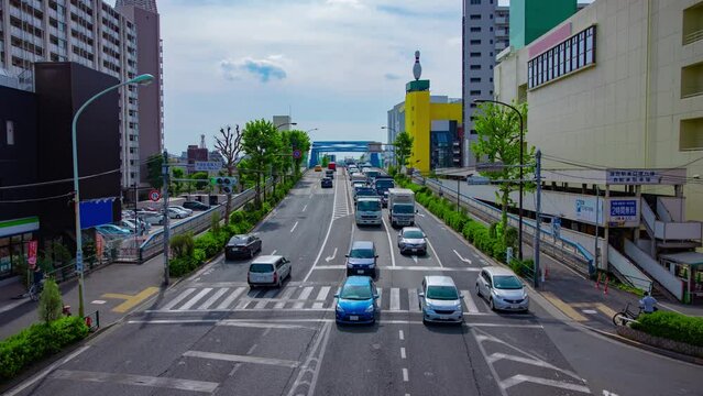 A timelapse of downtown street at Kanpachi avenue in Tokyo wide shot tilt