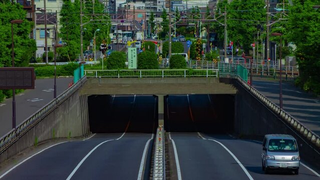 A timelapse of downtown street at Kanpachi avenue in Tokyo long shot tilt