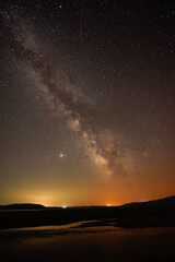 Fototapeta premium A breathtaking view of the Milky Way at night in Arpi lake, Armenia