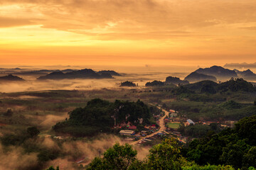 Background of mountains and nature surrounded, bright blue sky wallpaper. There are trees, green leaves, a beautiful ecology.