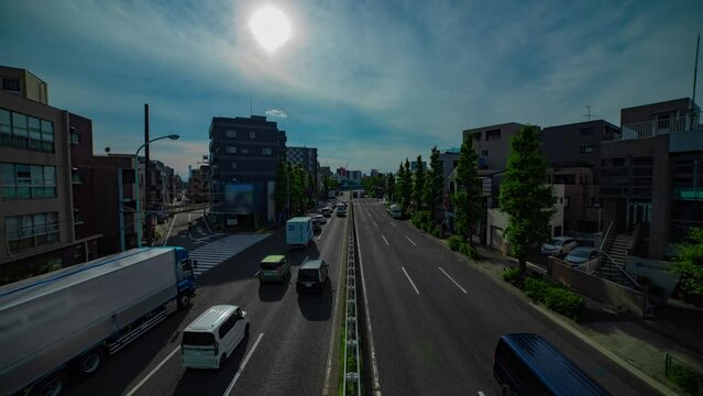 A timelapse of downtown street at Kanpachi avenue in Tokyo wide shot tilt