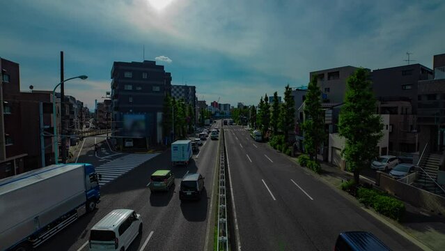 A timelapse of downtown street at Kanpachi avenue in Tokyo wide shot zoom