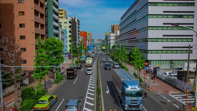 A timelapse of downtown street at Kanpachi avenue in Tokyo wide shot tilt
