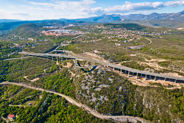 Aerial view of highway above town of Bakar