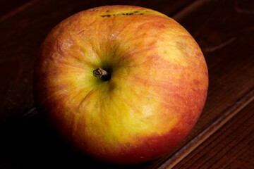 Spoiled shriveled rotten apple