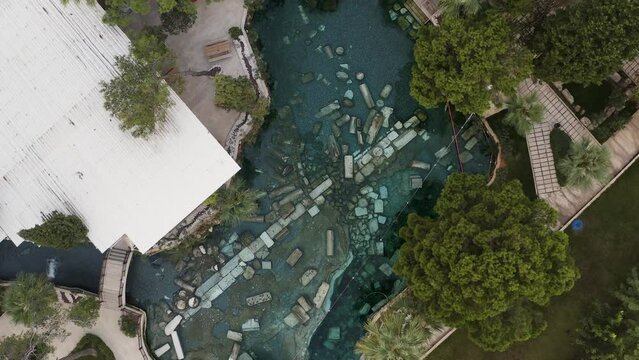 Aerial top view of Cleopatra's Ancient Pool, Ancient ruins of Hierapolis Pamukkale - Denizli - Turkey. Pamukkale, Turkey (Cotton Castle), ancient Hierapolis , One of the Turkish natural sites