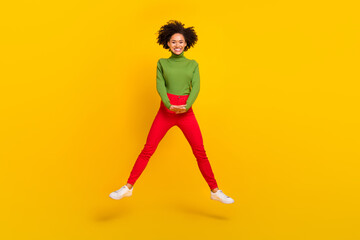 Fototapeta na wymiar Full body photo of young cheerful girl good mood jump travel dream isolated over yellow color background