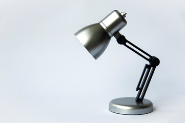 Closeup silver and black small lamp on white color background. Copy space concept