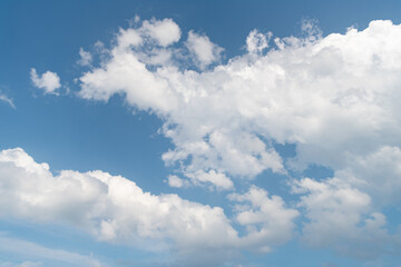 Naklejka na ściany i meble blue cumulus sky with white clouds in daylight