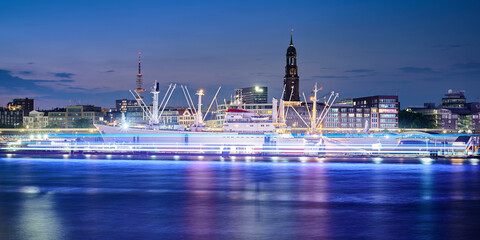 Historic Cargo Vessel Cap San Diego in City of Hamburg during night time with blue colored light...