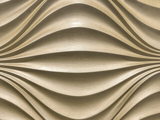 Beige 3D interior decorative wall panel with wavy pattern. Texture of pearl light brown background.