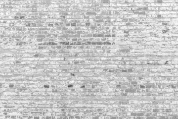 Fototapeta premium Old white brick wall. Peeling white paint on a white wall.