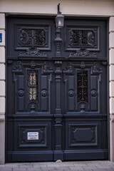 Munich, Germany - May 01, 2022: Old Decorative Main Entrance Wooden Door.