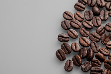 roasted coffee beans on gray background