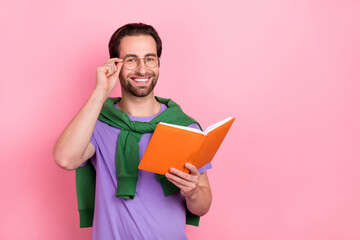 Photo of handsome good mood businessman reading professional book isolated on pink color background
