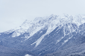 Fototapeta na wymiar Winter mountain landscape: The Rosa Khutor Alpine Resort near Krasnaya Polyana panoramic background.