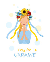 Beautiful ukrainian woman in a wreath with flowers prays for Ukraine. Stop war.