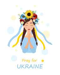 Beautiful ukrainian woman in a wreath with flowers prays for Ukraine. Stop war.
