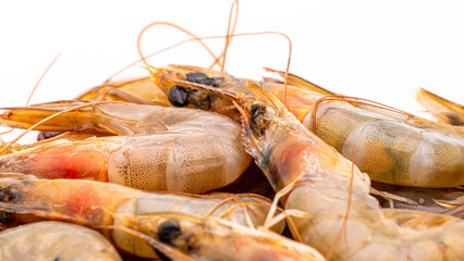 Raw Shrimp prawns closeup on white background. Selective focus