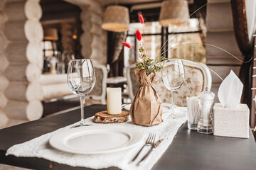 Luxury table setting for couples dining in a restaurant in pastel colors close up