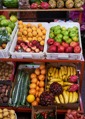 A close up of colourful fruit and vegetable stall at a local market