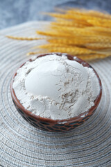 wheat flour in a bowl on table 