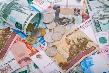 Background of Russian rubles, banknotes and coins close-up