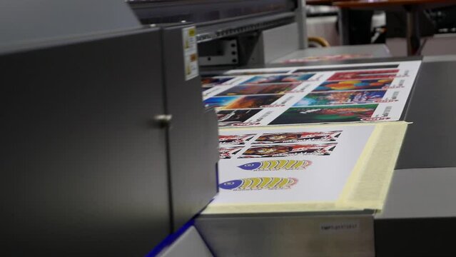 Printing plotter with UV lamp for curing the print.