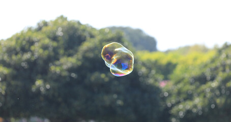 bubble blower on blue sky background