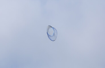 bubble blower on blue sky background