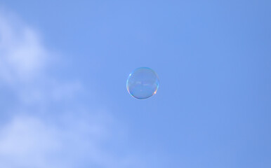 bubble blower on blue sky background