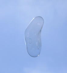 bubble blower on blue sky background