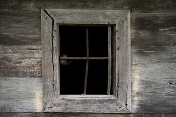 Croatia, May 01,2022 : Rustic style aged window at rural home wall.