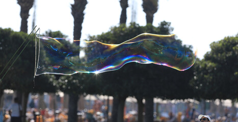 Naklejka premium bubble blower on blue sky background
