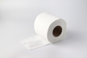 Rolls of toilet paper on light gray background.