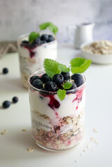 Fototapeta na wymiar Healthy breakfast or snack with chia seeds, oatmeal and berries