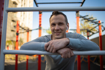 A man is engaged in sports outside on the playground, fitness, sport, lifestyle.