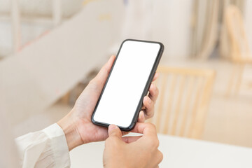 cell phone blank white screen mockup.hand holding texting using mobile on desk at office.background empty space for advertise.work people contact marketing business,technology