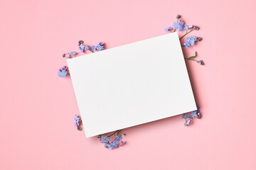 Wedding invitation or greeting card mockup with flowers © nikavera