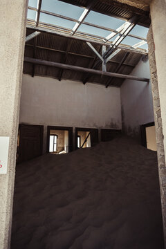 Inside destroyed buildings. Photo from the ghost town of Kolmanskop, nearby L&uuml;deritz, in the Namib desert. Namibia, Africa.